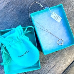 Elsa Peretti Open heart Tiffany necklace. Never worn…with box and bag.